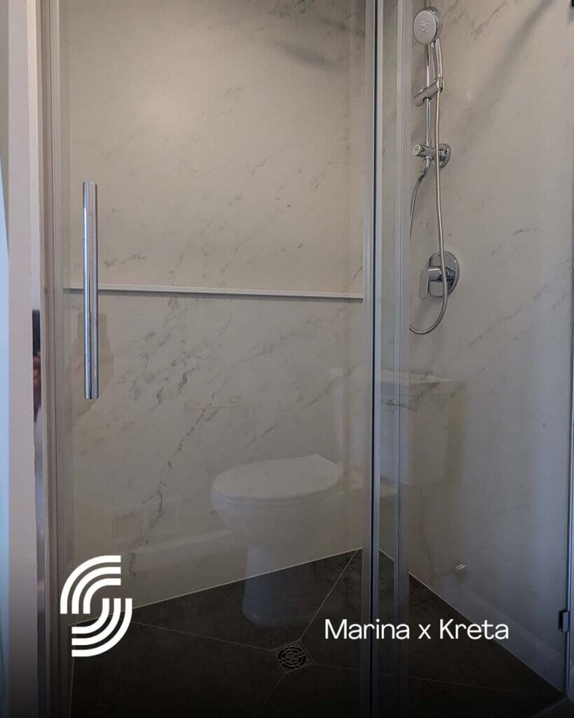 Remodeled Curbless Shower with Dekton Marina and Dekton Kreta Slabs